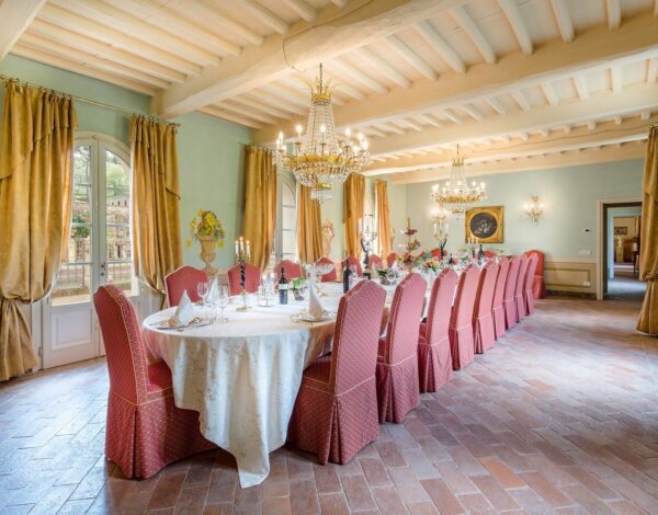 The banquet room of Villa Contrada, with one long table laid for the whole party