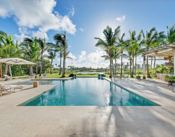 A long pool among the palms at a villa in Punta Cana