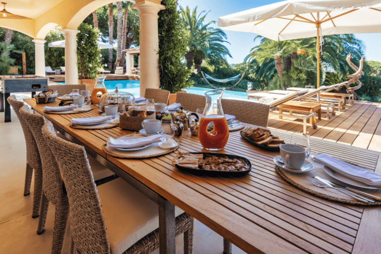 Table set for lunch by the pool at Villa La Ramande, Saint-Tropez