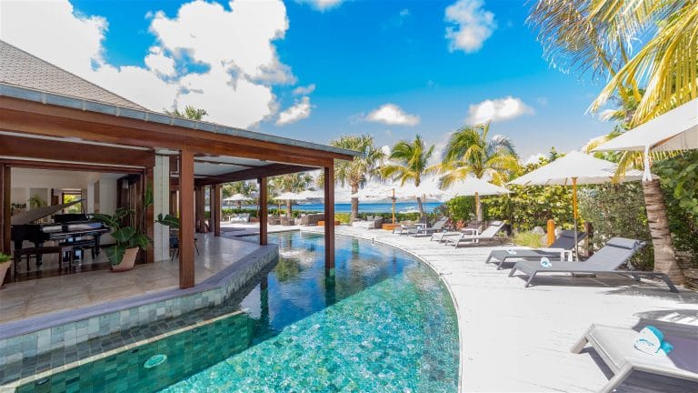 The pool and covered terrace of Villa La Plage, St Barts