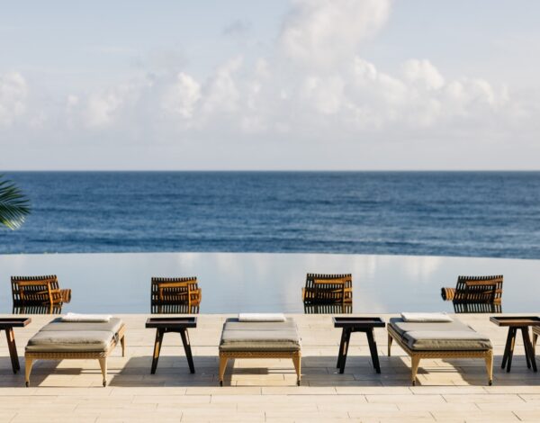 An infinity pool and loungers facing the Atlantic at &Agrave;NI, Dominican Republic