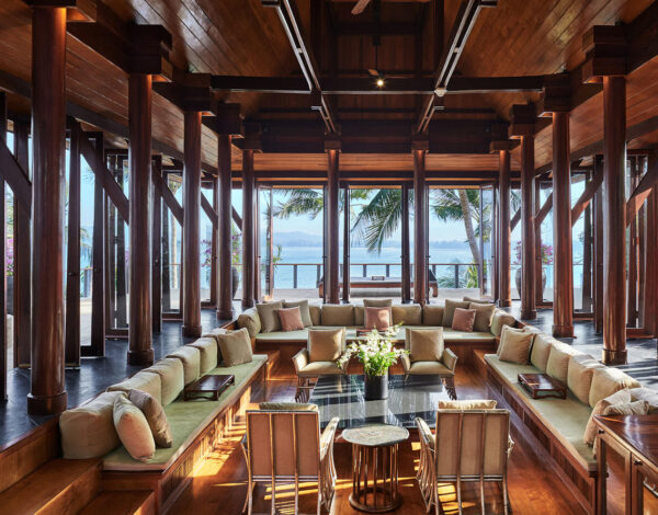 A timber pavilion lounge open to the trees at Amanpuri, Phuket