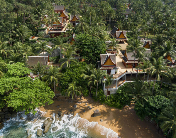 Pavilion roofs among the trees above the sea at Amanpuri, Phuket