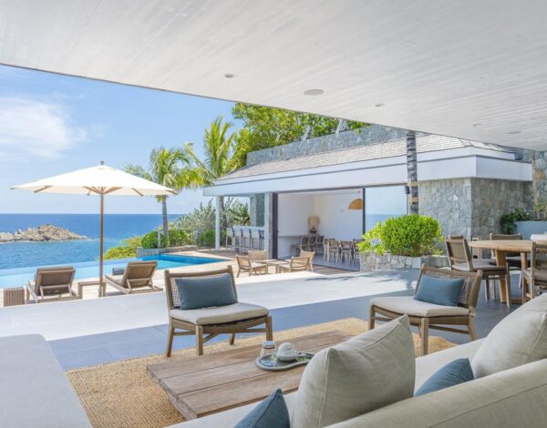 Flights to St Barts from the US: How to Get There, Step by Step 3 The covered outdoor lounge of Villa Roxane, opening onto the pool deck and the sea
