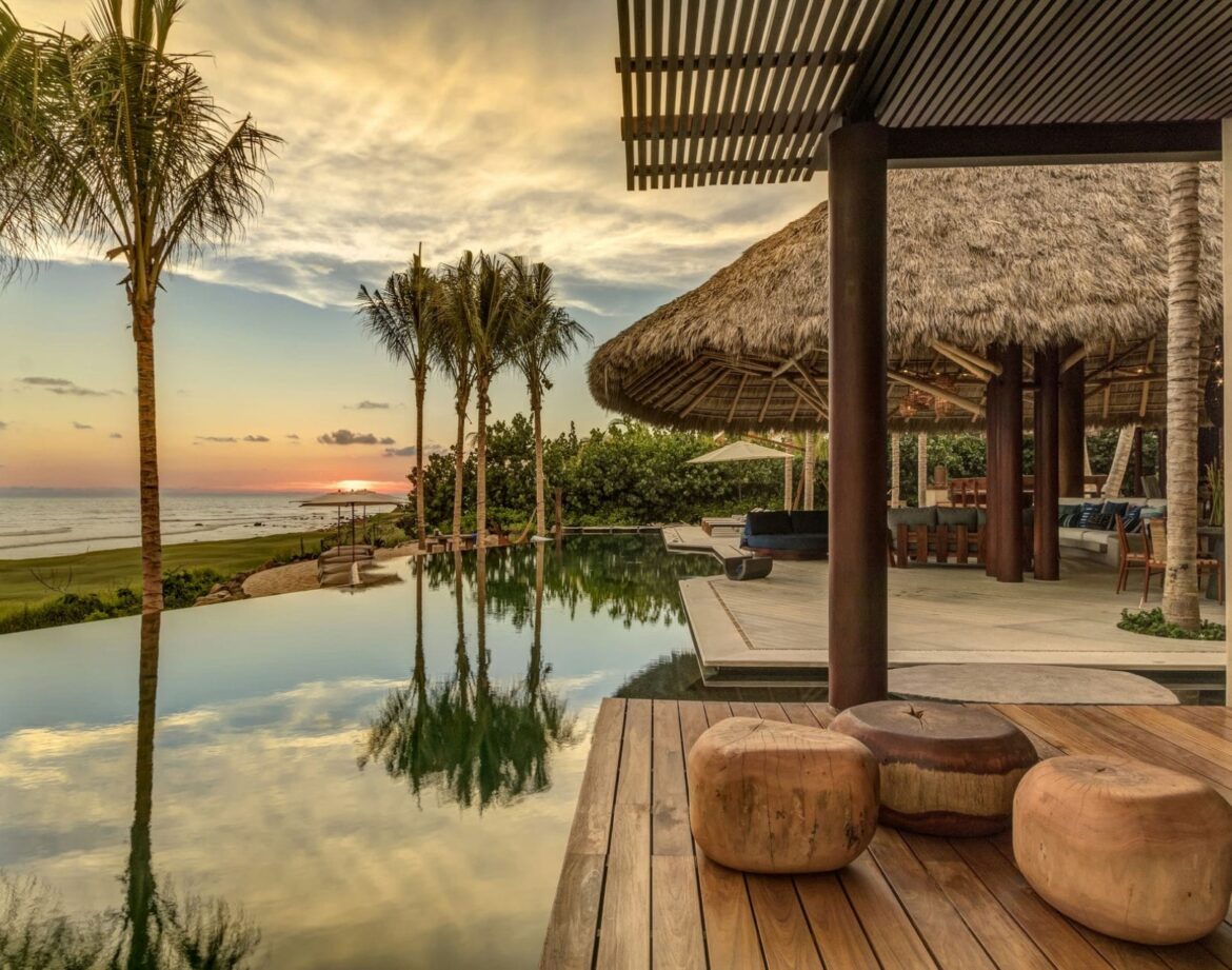 Luxury beachfront villa at sunset