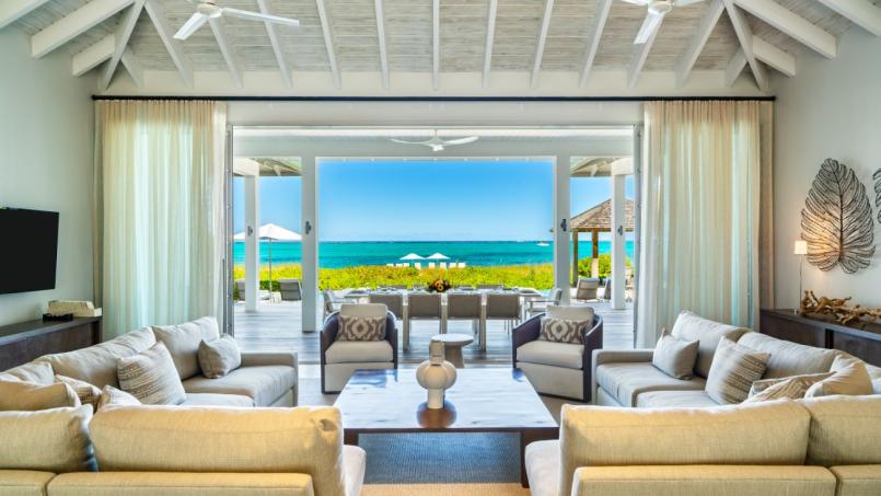 the exquisite Villa Portofino at Grace Bay offers a luxurious escape like no other. Nestled privately within a gated property on Grace Bay Beach in Turks and Caicos,