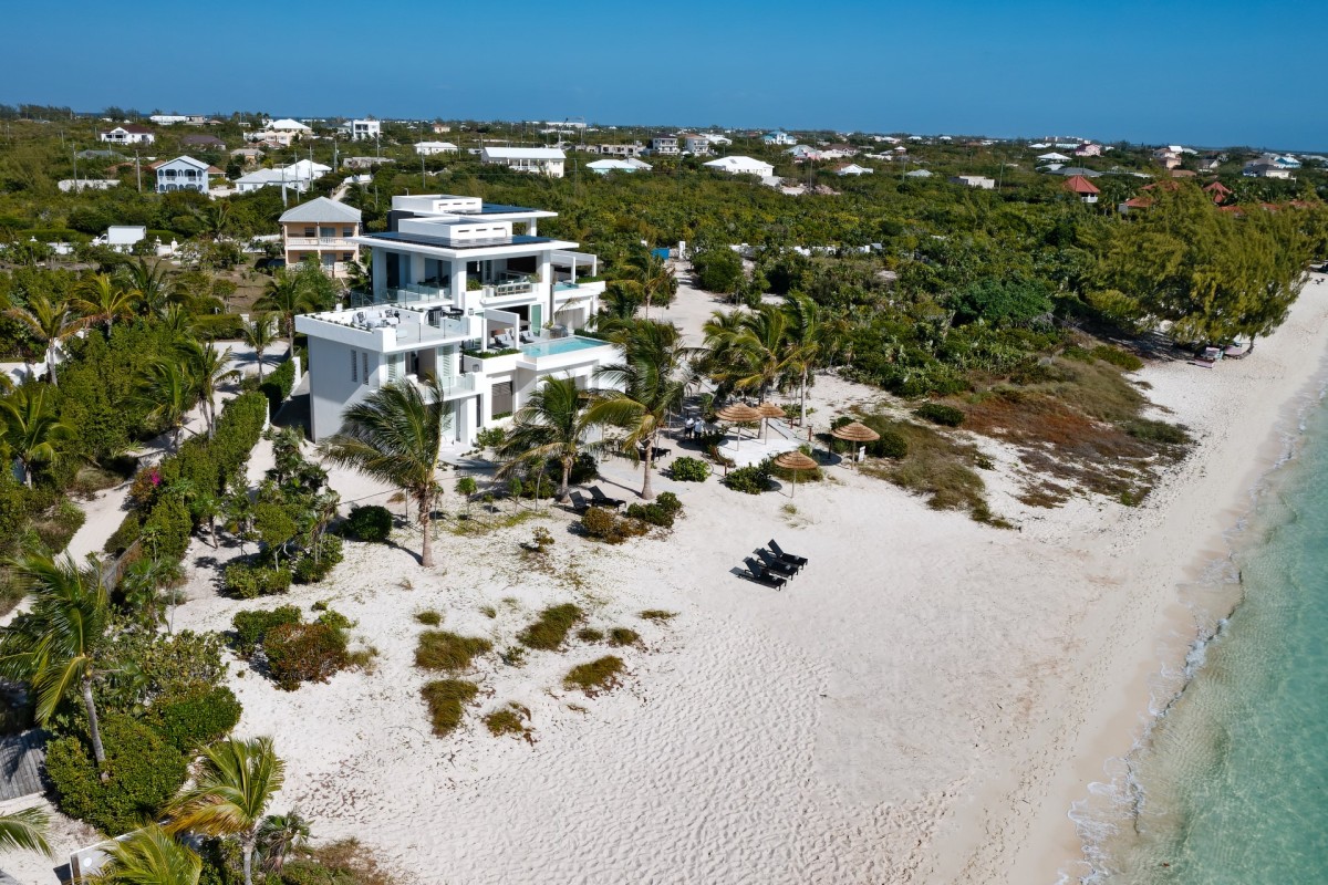 Villa Blue Lagoon in Providenciales, Turks & Caicos offers a luxury beachfront escape with stunning views of Long Bay Beach.