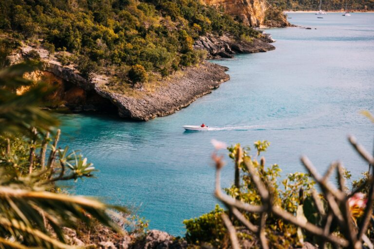 A boat in the clear water of Little Bay, Anguilla
