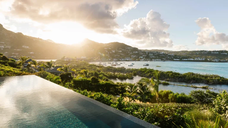 An infinity pool looking over the bay at sunset, St Barts