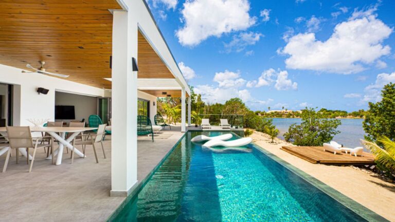 A long infinity pool and covered terrace at a villa in St Martin