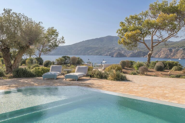 An infinity pool and pines above the sea at Casa Serenity, Ibiza