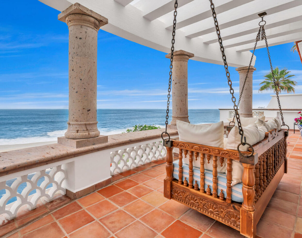 Elegant swing overlooking serene ocean view