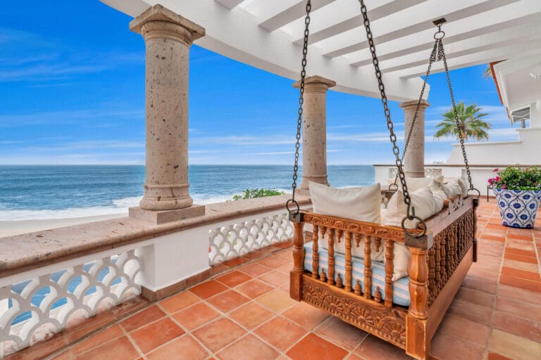 Hanging daybed on a terrace above the sea at a Los Cabos villa