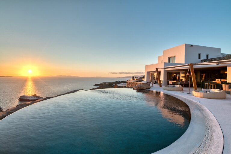 Luxury Villa Destinations Worldwide | Haute Retreats 11 The infinity pool of Villa Zeus at sunset, above the sea at Agia Sophia