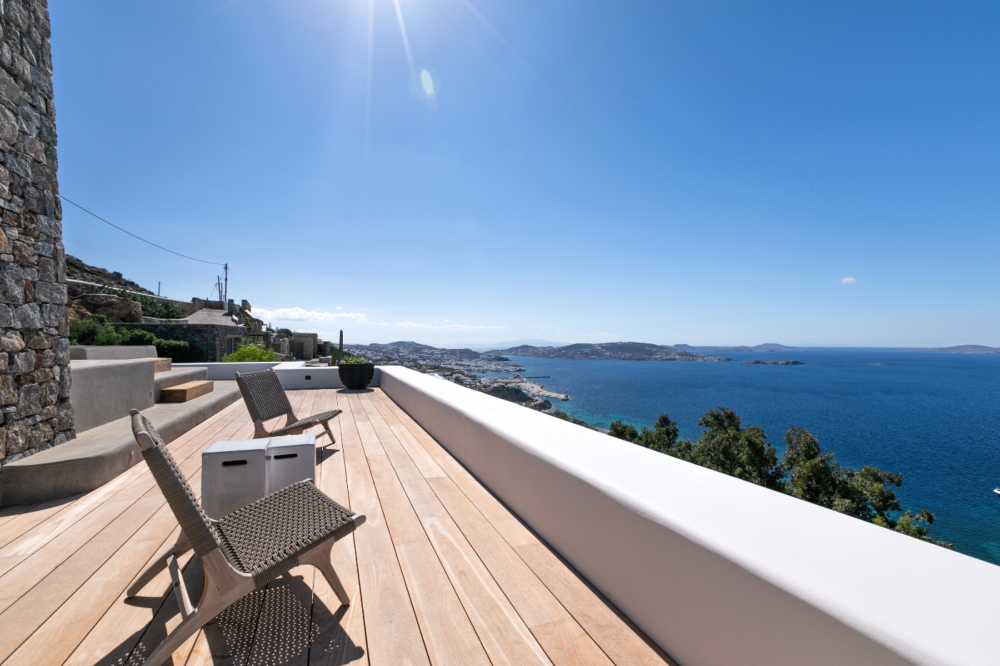 Mykonos vs Santorini Which Is Better for Your 2026 Greek Island Getaway? 2 Mykonos vs Santorini Which Is Better for Your 2026 Greek Island Getaway? - 219 8001 Syros veranda and JacuzziVilla Zeus. Mykonos large villa Haute Retreatsjpg