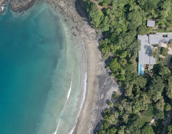 A cove and its beach below the forest, Costa Rica, from the air