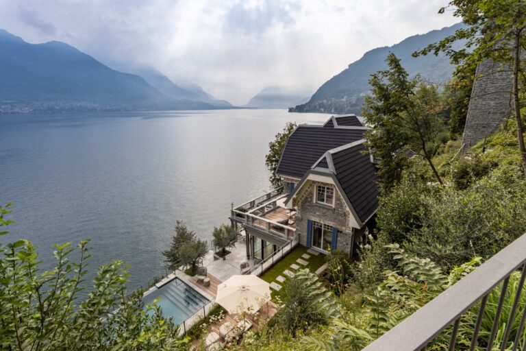 Scenic lakeside villa with mountains backdrop breakwater bellagio