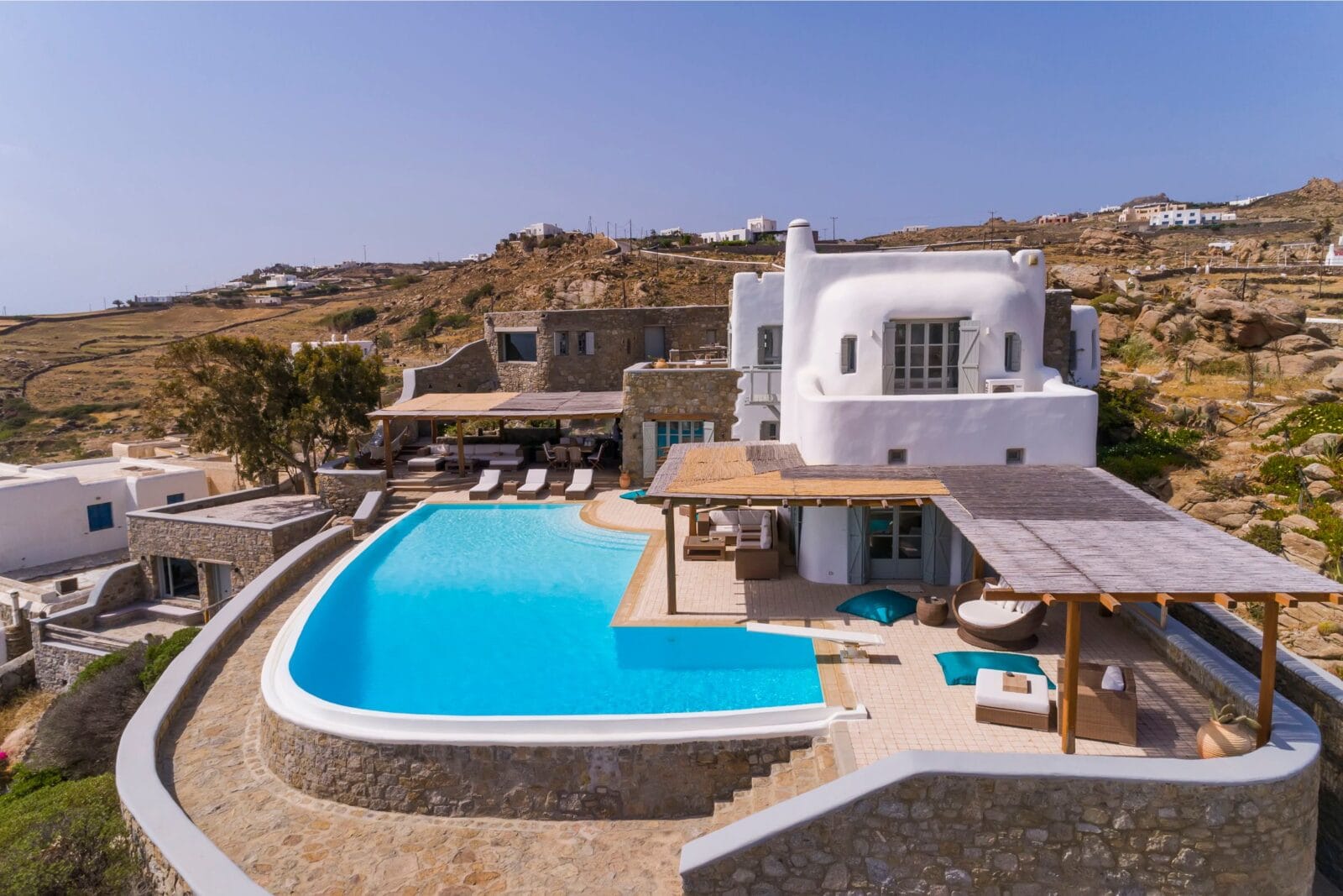 Luxury Greek villas still available in late August 2026, a Mykonos villa terrace above the Aegean