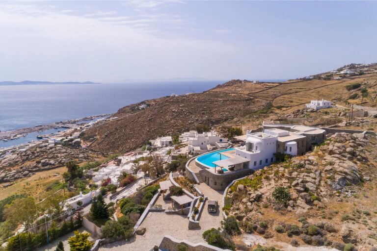 Luxury Mykonos villa with sea view and infinity pool on a hillside, the base for orchestrated Mykonos villa holidays