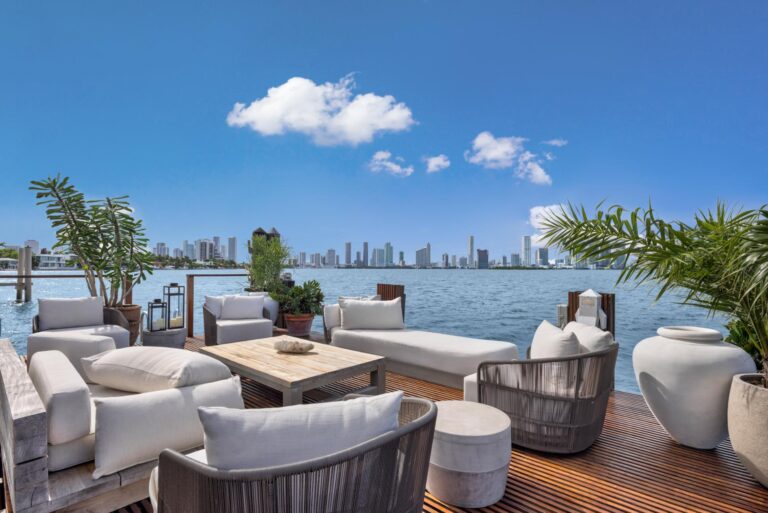 Stylish waterfront seating with city skyline.