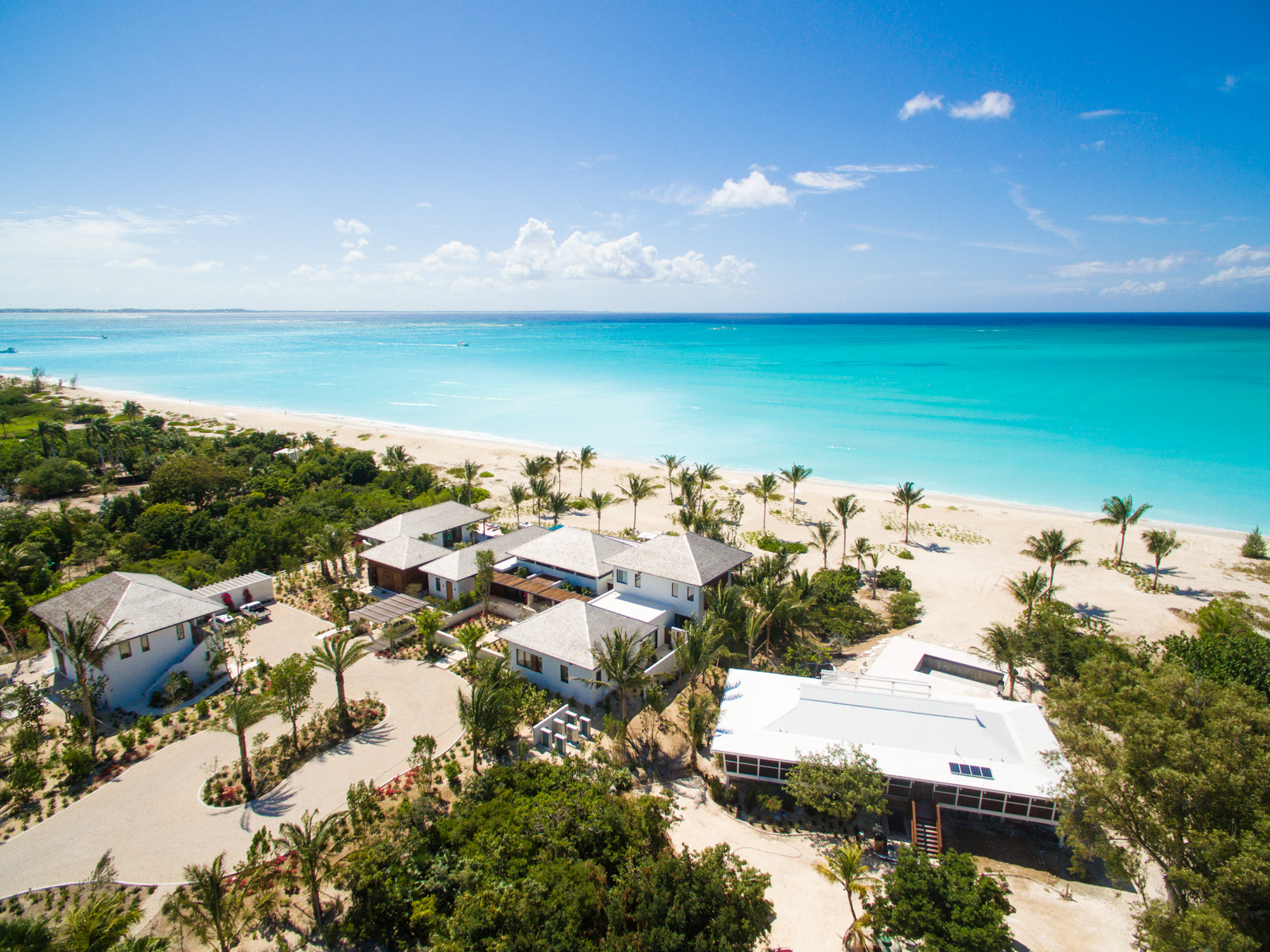 Turks and Caicos Villas and Luxury Vacation Rentals 1 Turks and Caicos villa terrace with infinity pool overlooking the turquoise Leeward lagoon