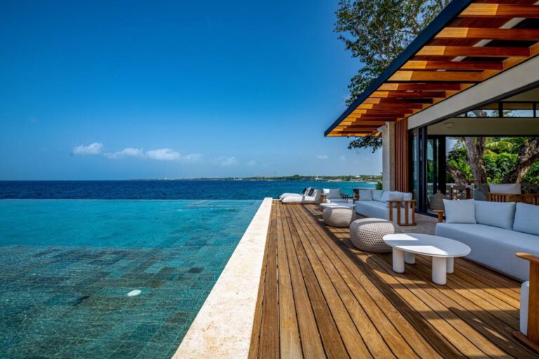 A deck with loungers above the clear sea at Punta Aguila, Casa de Campo