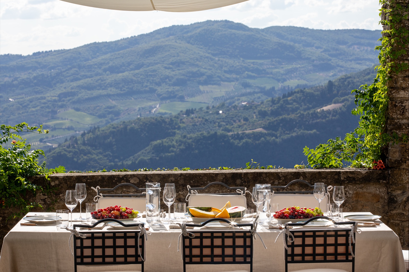 Event table on an infinity-pool terrace, seen from above