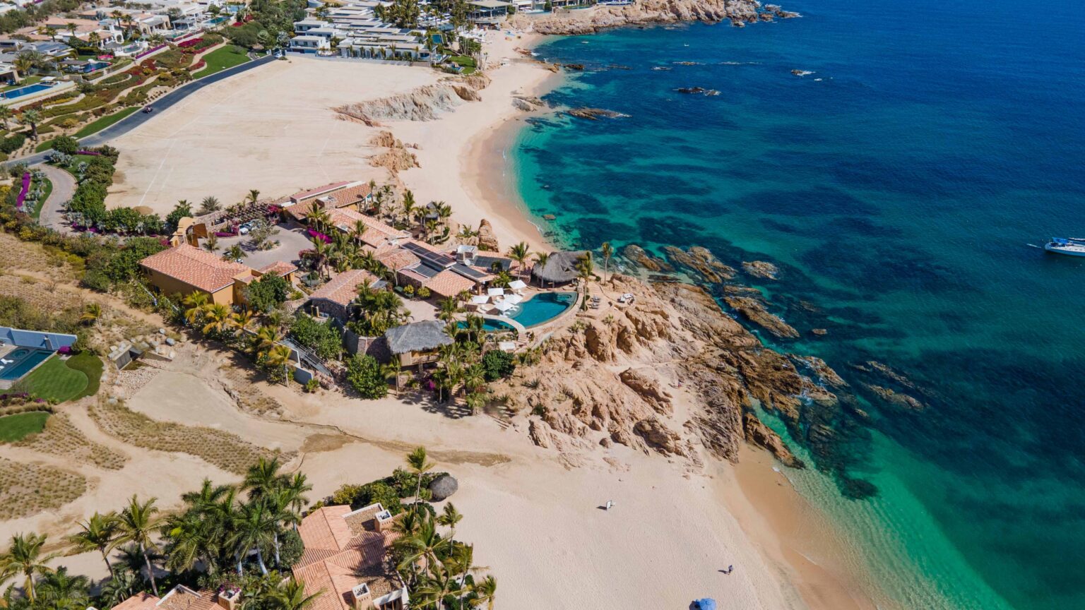 The Best Countries to Visit in March 2027, From Cabo’s Whales to Late-Season Alpine Snow 1 Cielito del Mar on its rocky point above the beach and the clear water of Chileno Bay, Los Cabos