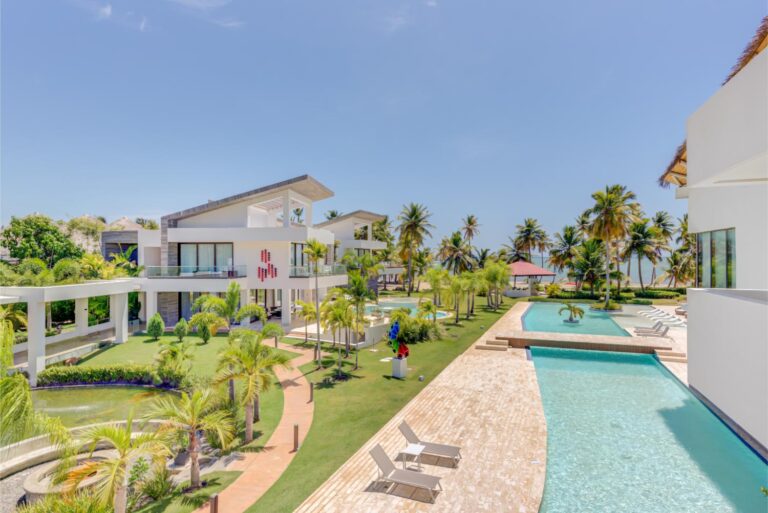 Luxury Villa Destinations Worldwide | Haute Retreats 6 The long pool of Villa Guacamaya running between the house and the palms on Playa Juanillo