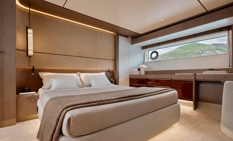 The full-beam master cabin, with a long window in the hull just above the water