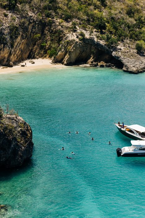 Clear water, boats, swimmers, scenic cove. Anguilla is a beautiful island